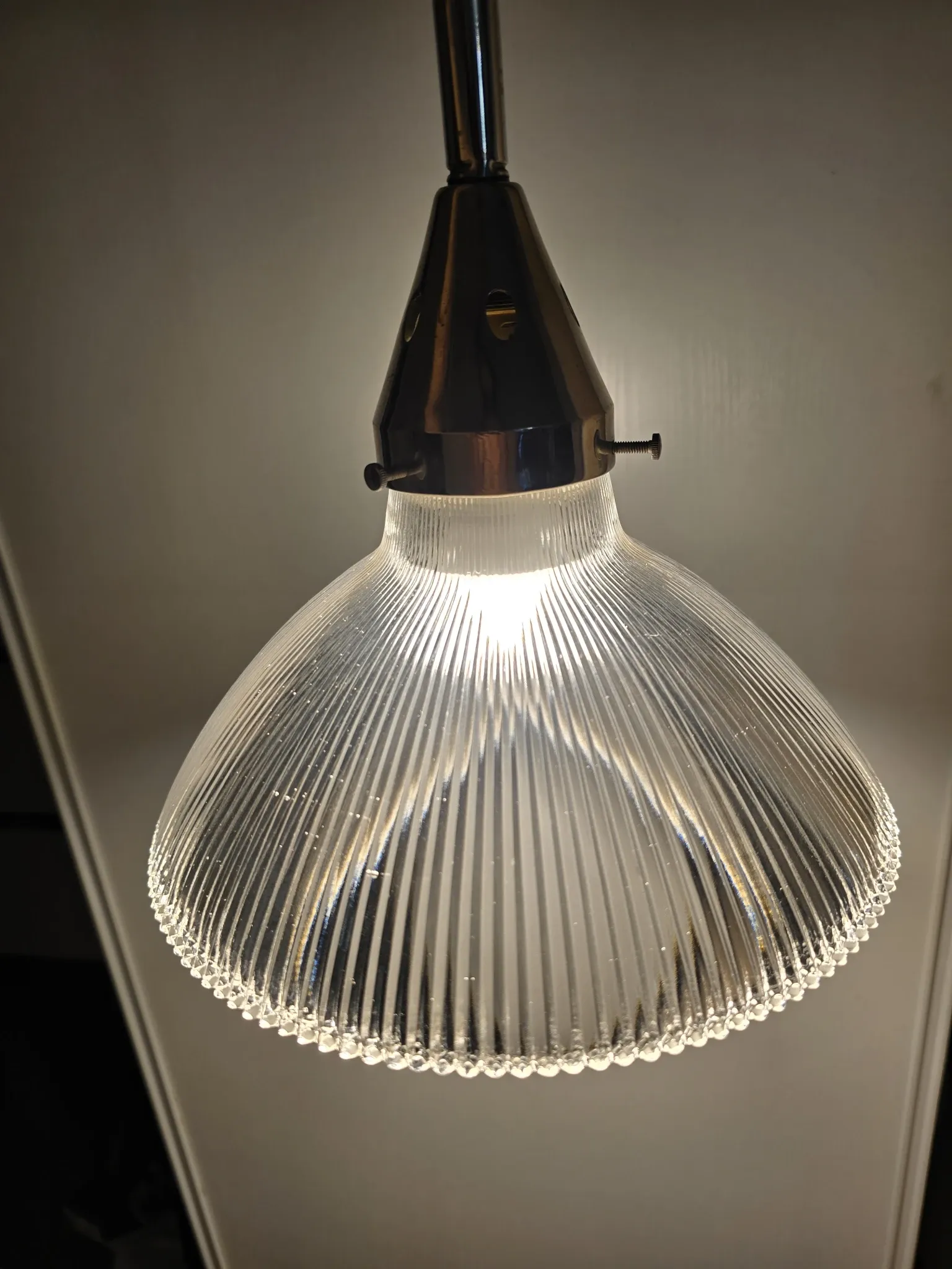 Vintage globe-style holophane on a chrome stem.