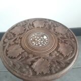 Carved wooden hunting stool decorated with vines