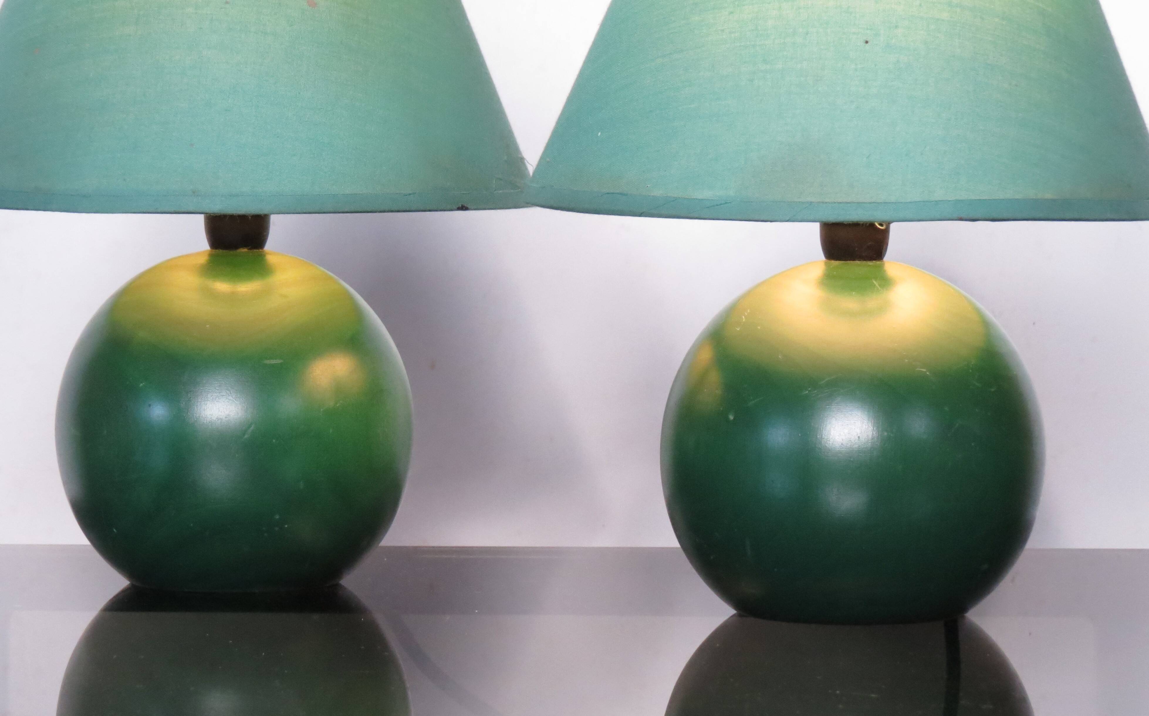 Pair of small green wooden ball lamps