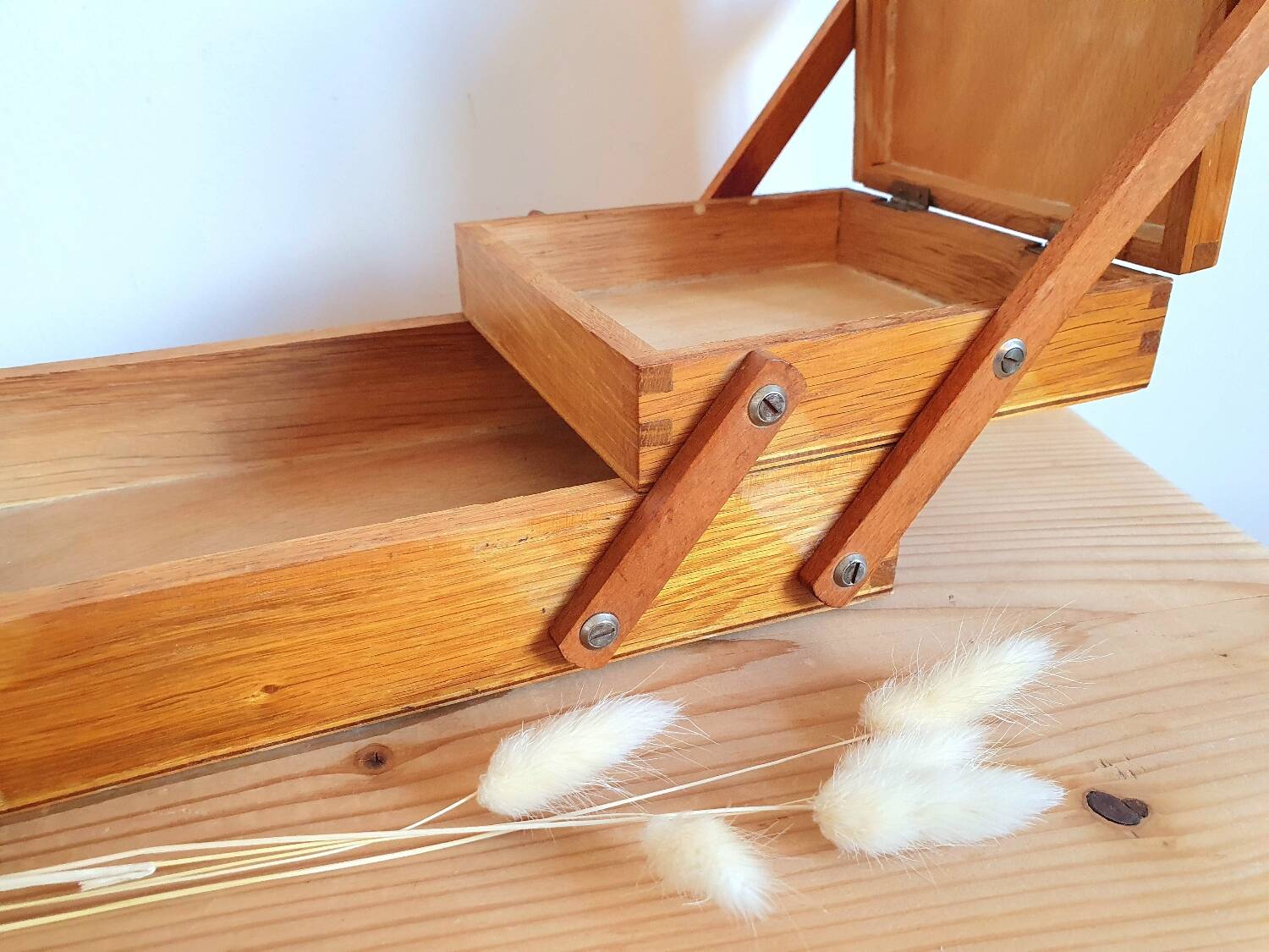 Small wooden sewing worker