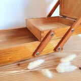 Small wooden sewing worker