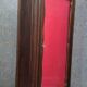 Wooden display cabinet with stained finish – red upholstered interior – 20th century