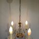 4-light glass and brass chandelier