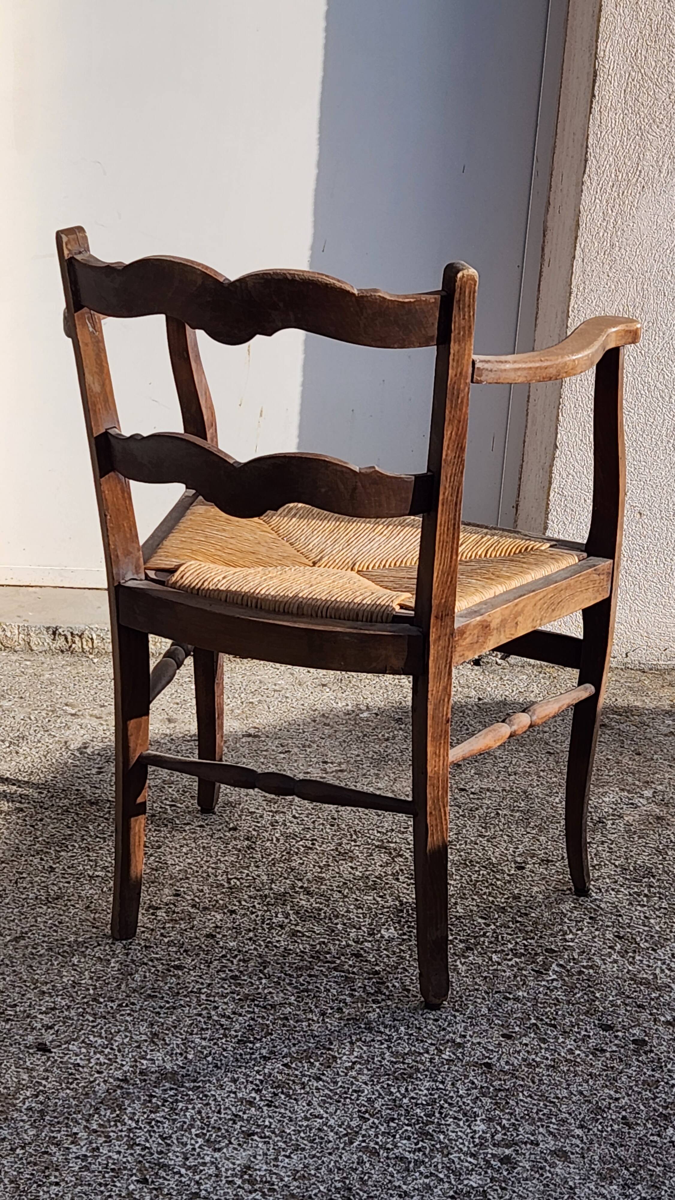 Rustic armchair made of wood and straw