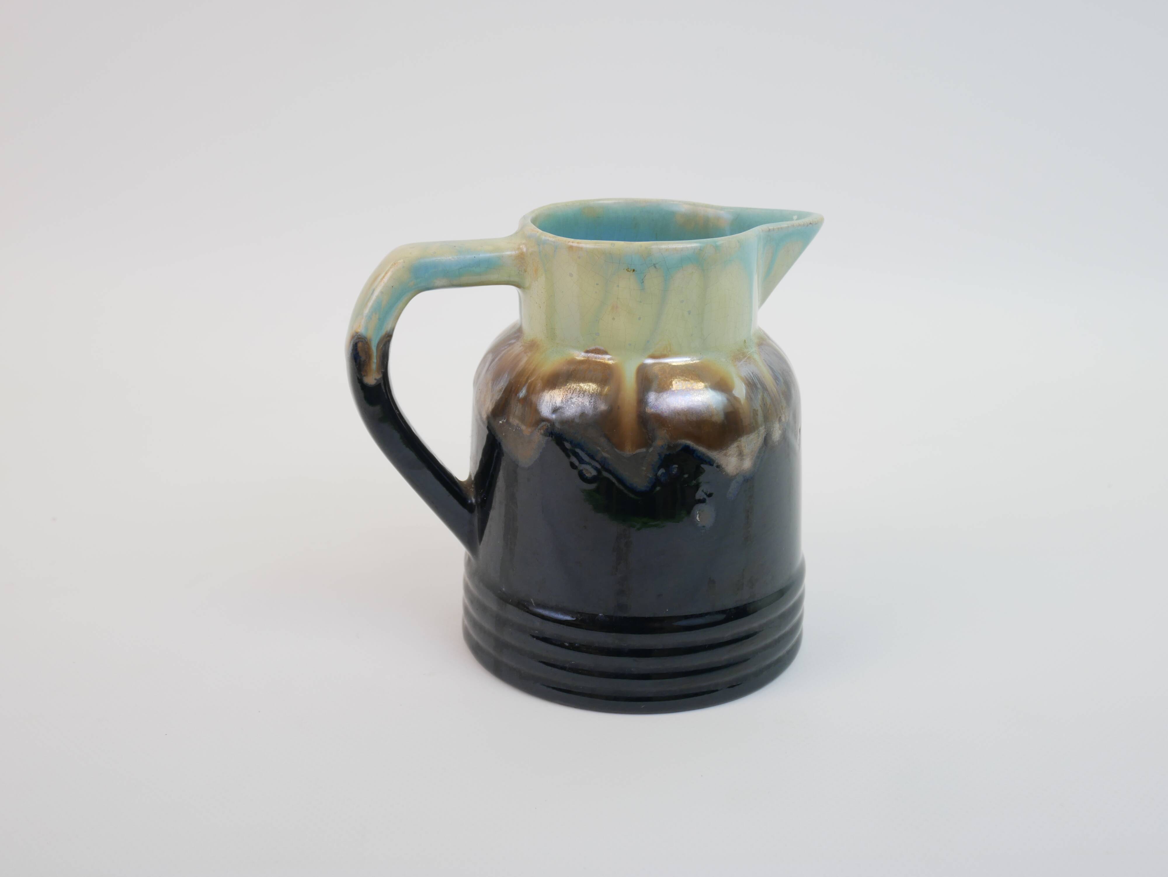 Art Deco pitcher in black, brown and blue glazed ceramic