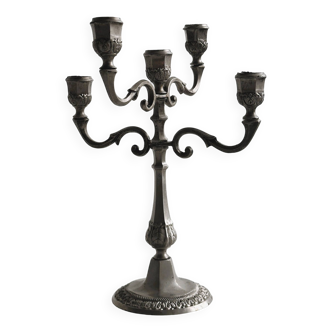 Antique four-branched candlestick.