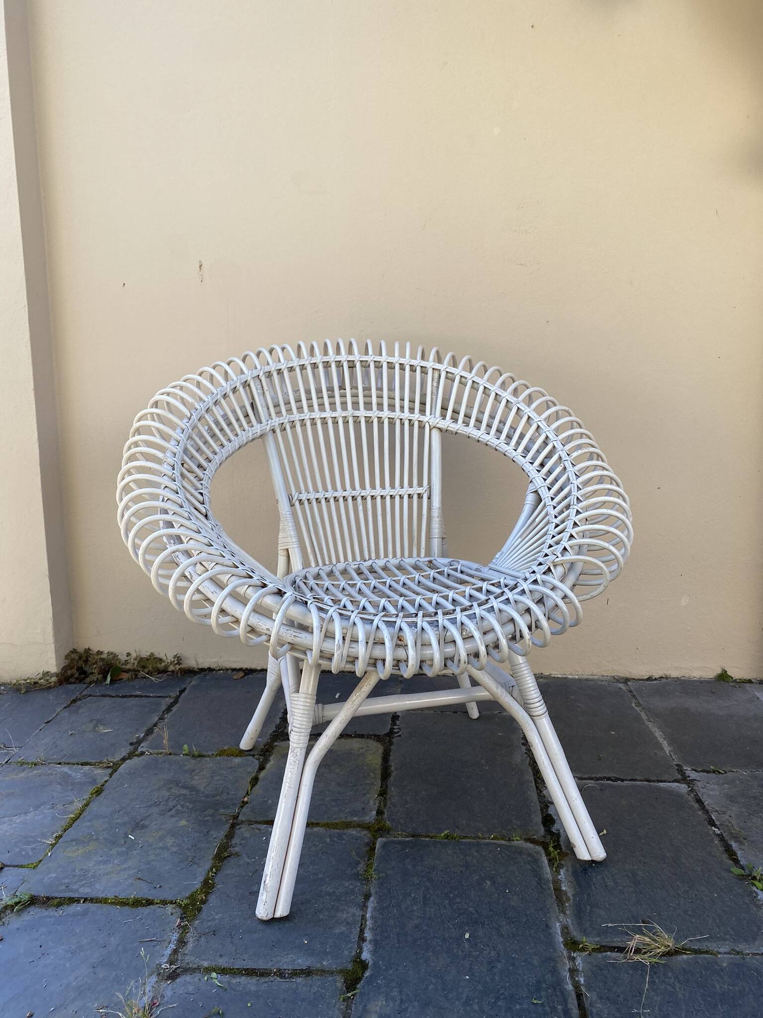 Vintage white rattan armchair