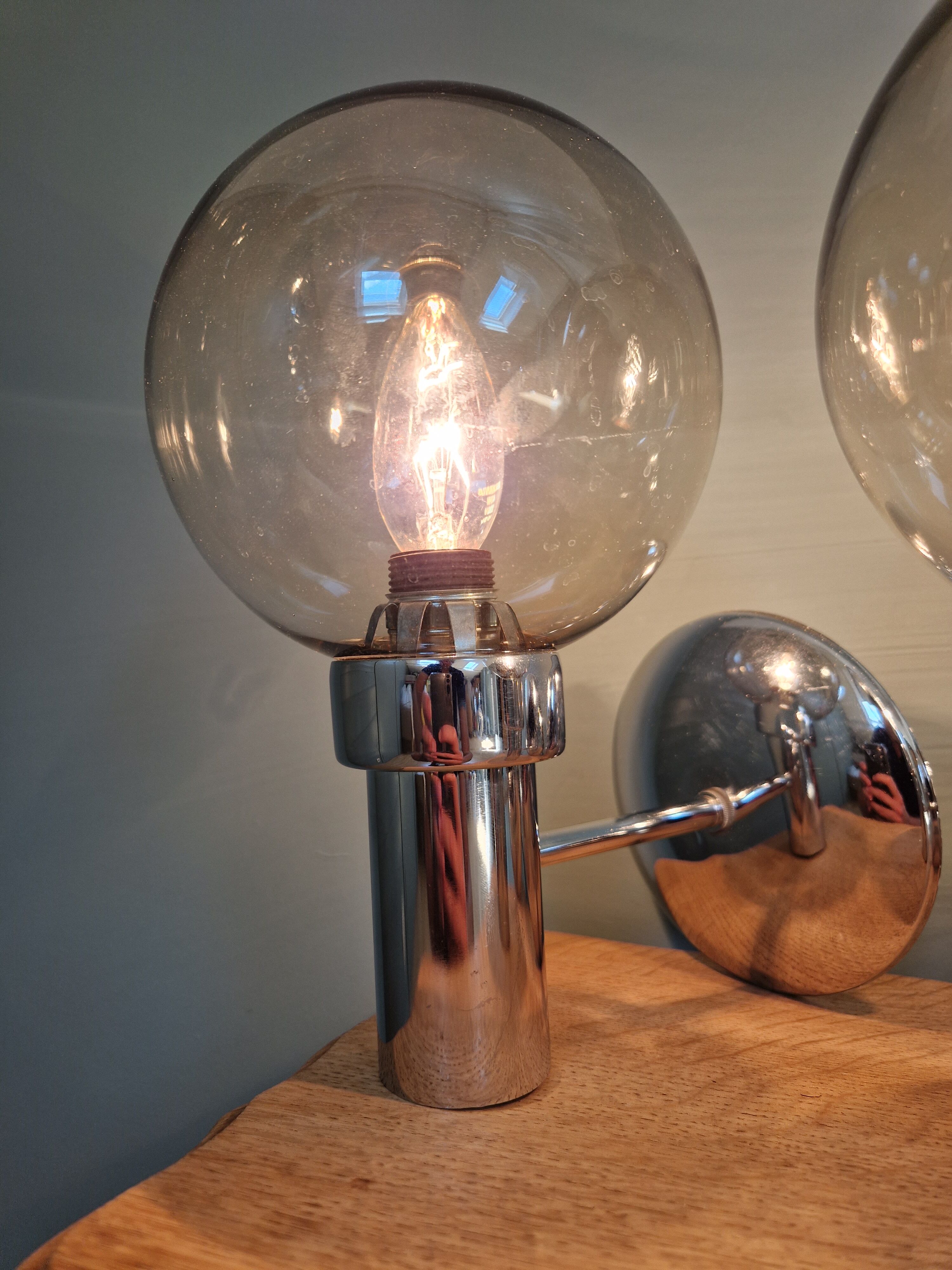 Pair of vintage wall lights in chromed metal and smoked glass, 70s