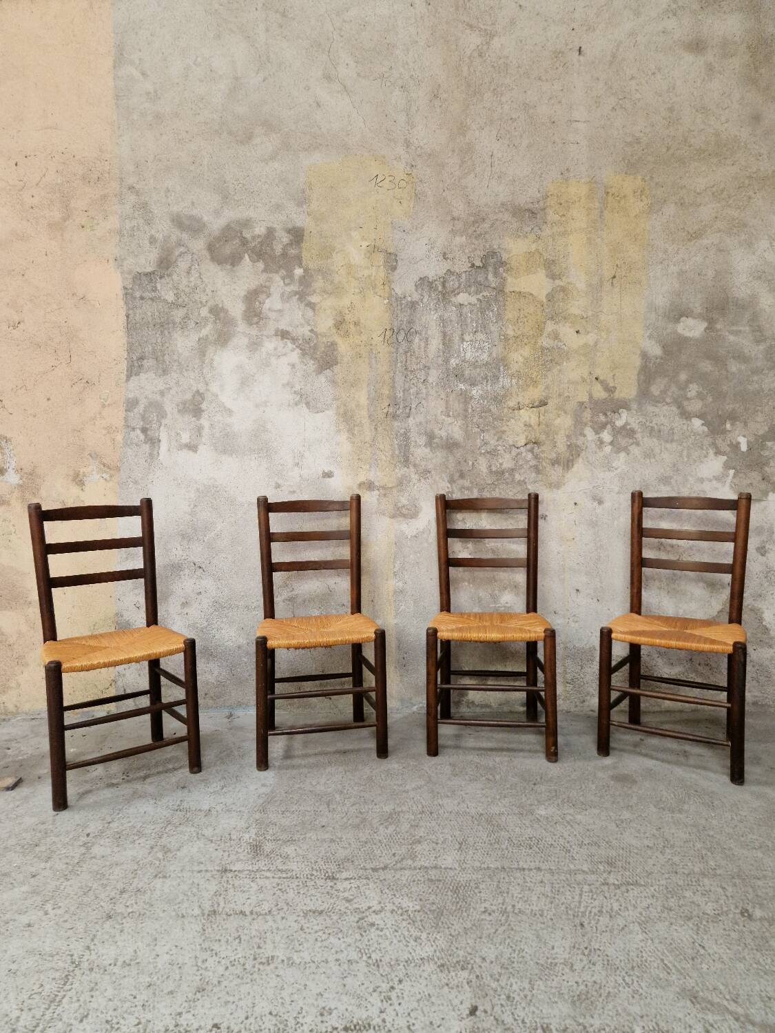 4 wooden and straw chairs