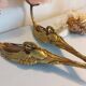 Pair of bronze swan and pink tulip wall lights in glass paste
