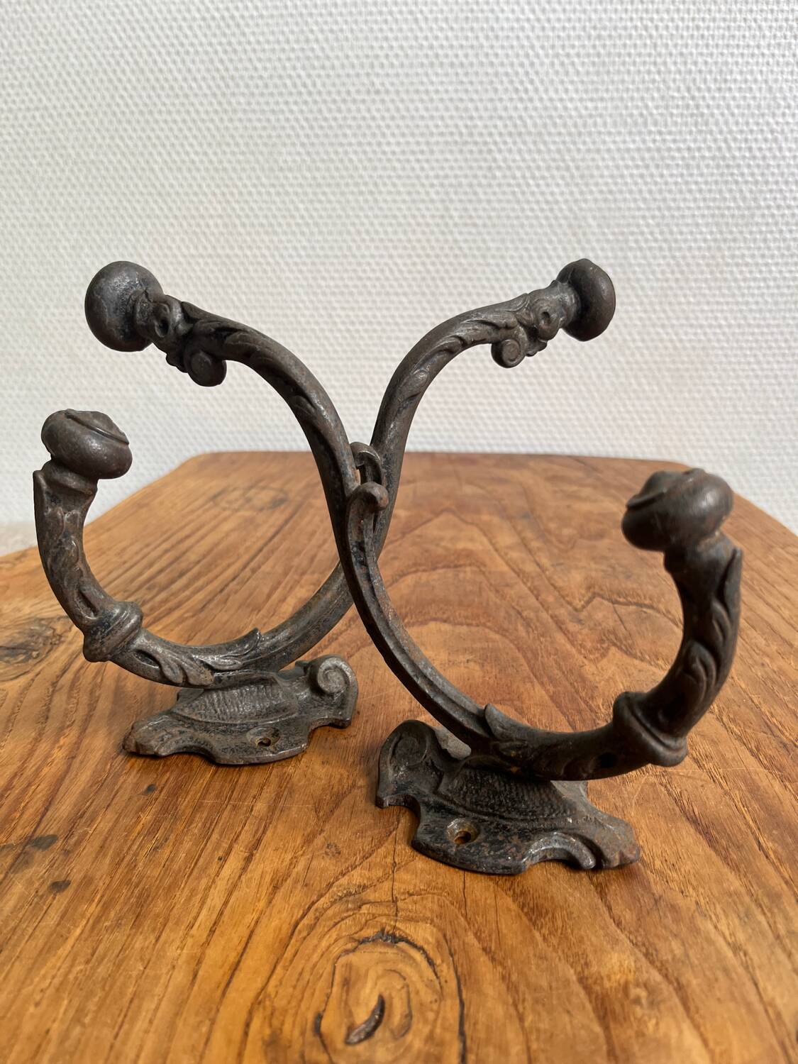 Pair of old cast iron coat hooks