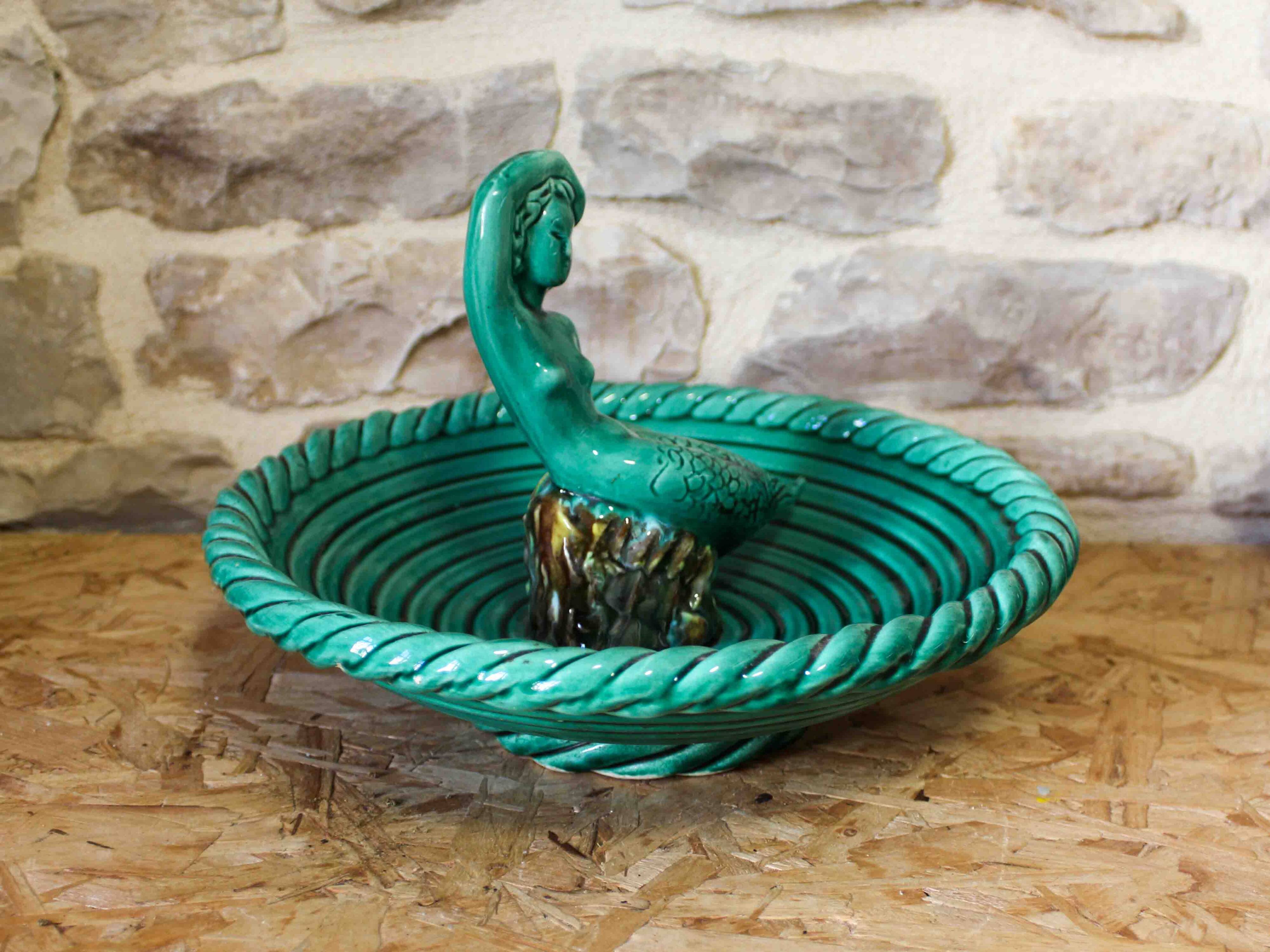 Ceramic cup with mermaid decoration