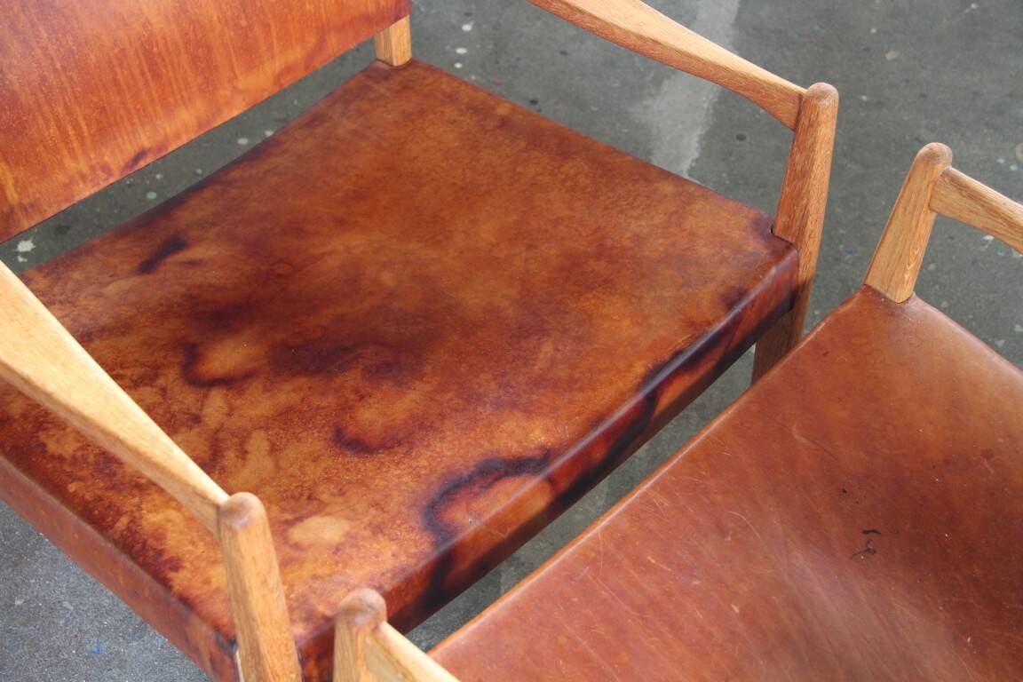 Pair of vintage Per-Olof Scotte "Premier 69" oak armchairs in cognac leather