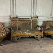 Pair of corner armchairs and an Orientalist bench in carved and polychrome wood from around 1900.