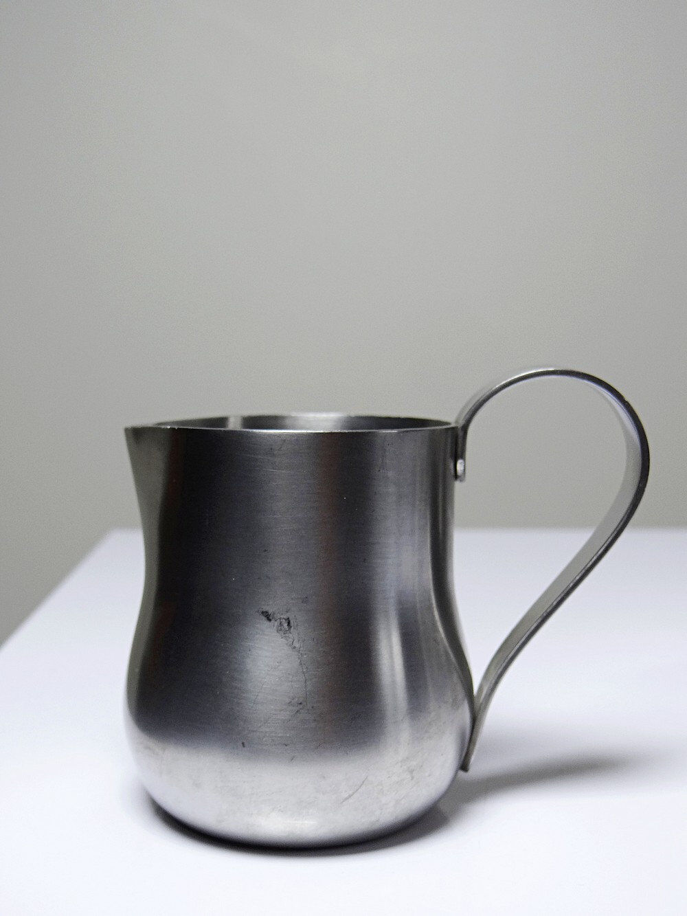 Set of 4 vintage bar measures in brushed stainless steel from the 60s-70s.