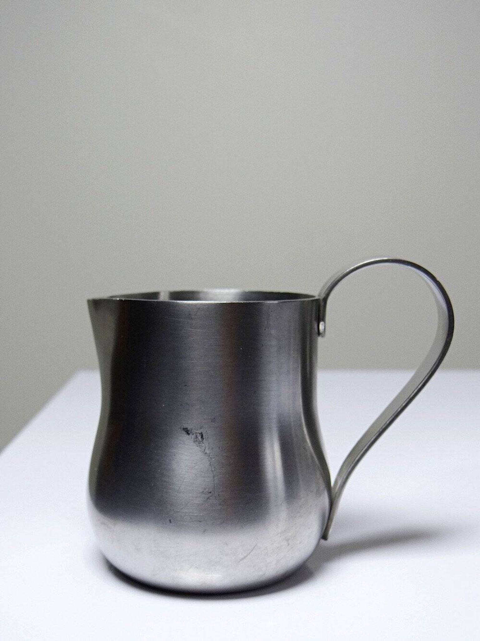 Set of 4 vintage bar measures in brushed stainless steel from the 60s-70s.