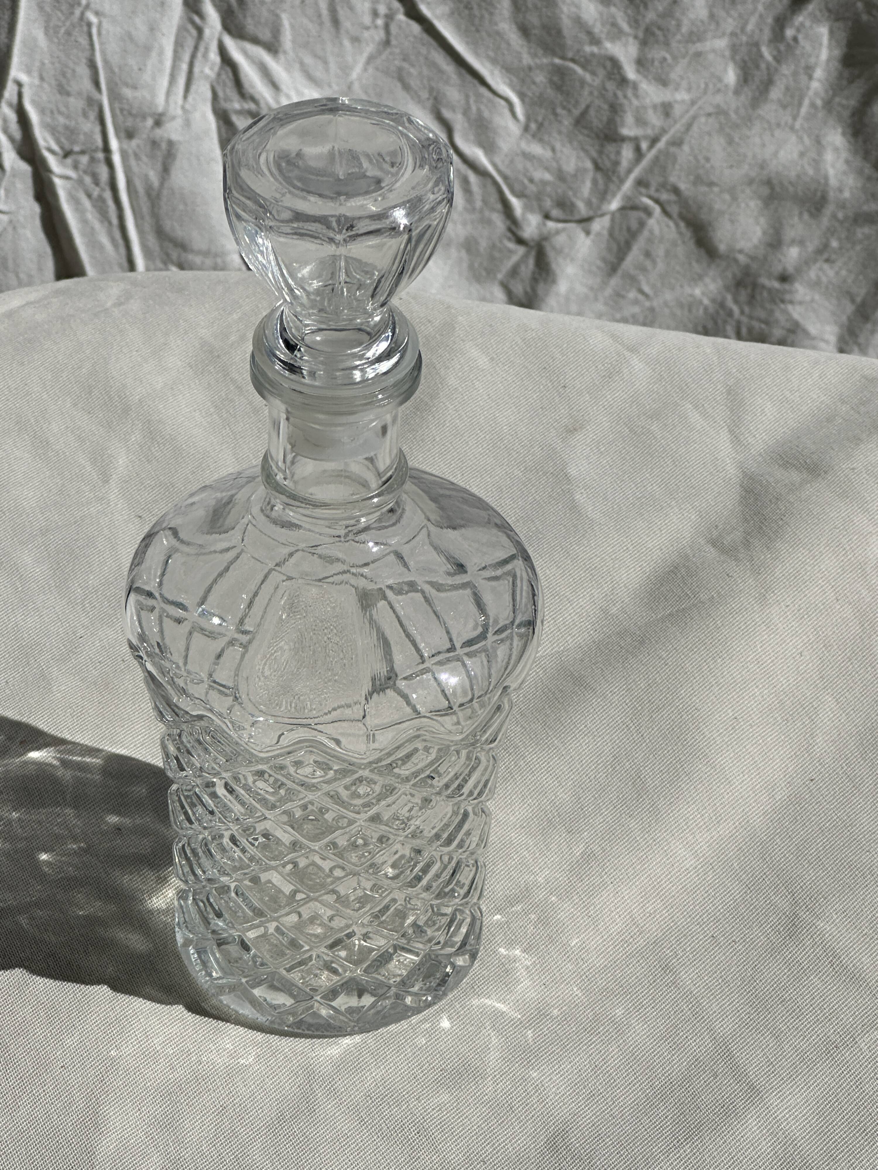 Small cylindrical glass whiskey decanter H:23