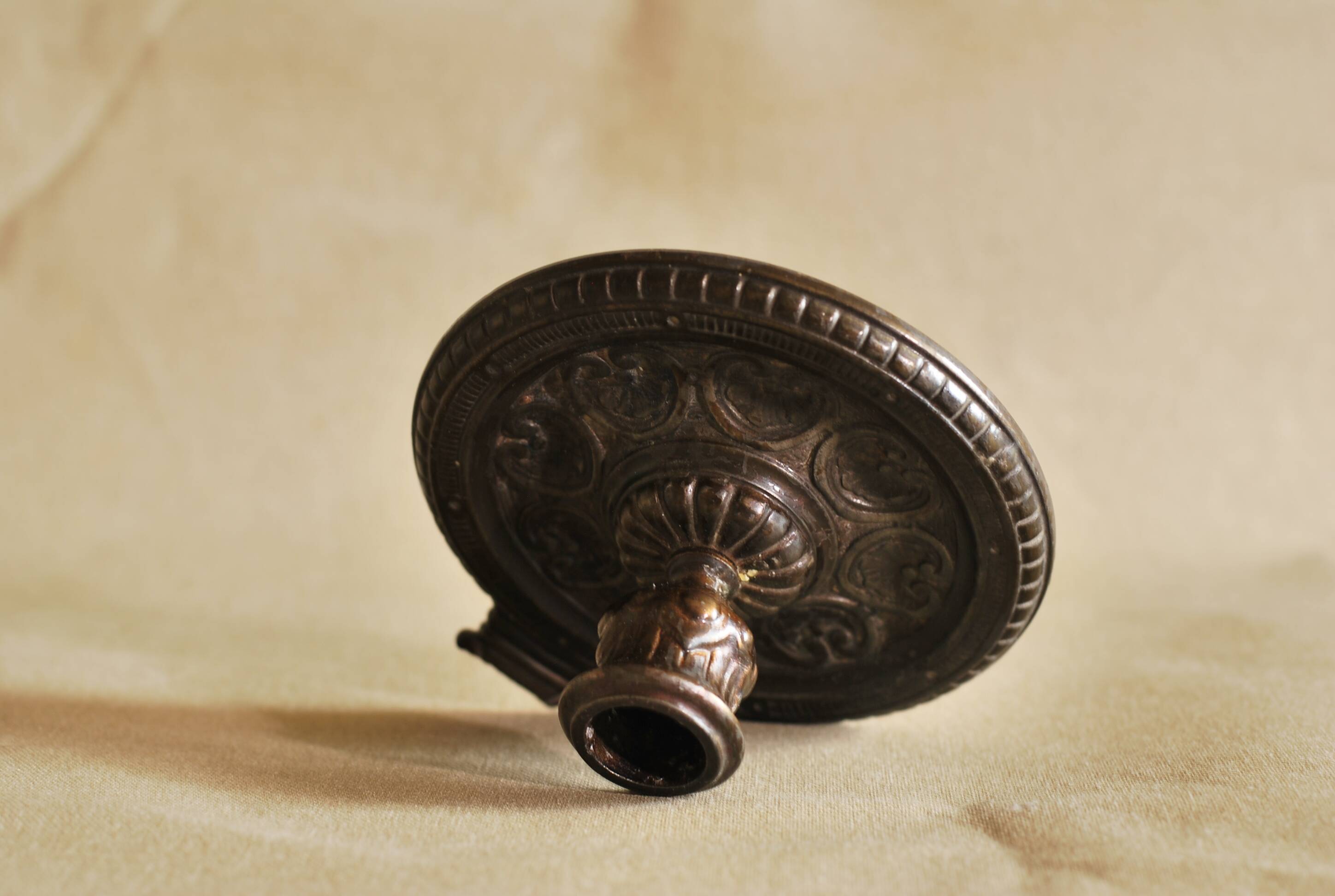 Bronze cellar rat hand candle holder