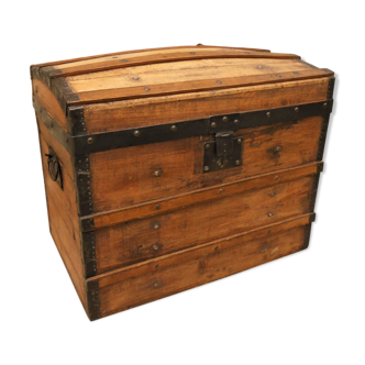 Ancient travel trunk, bulging wooden chest
