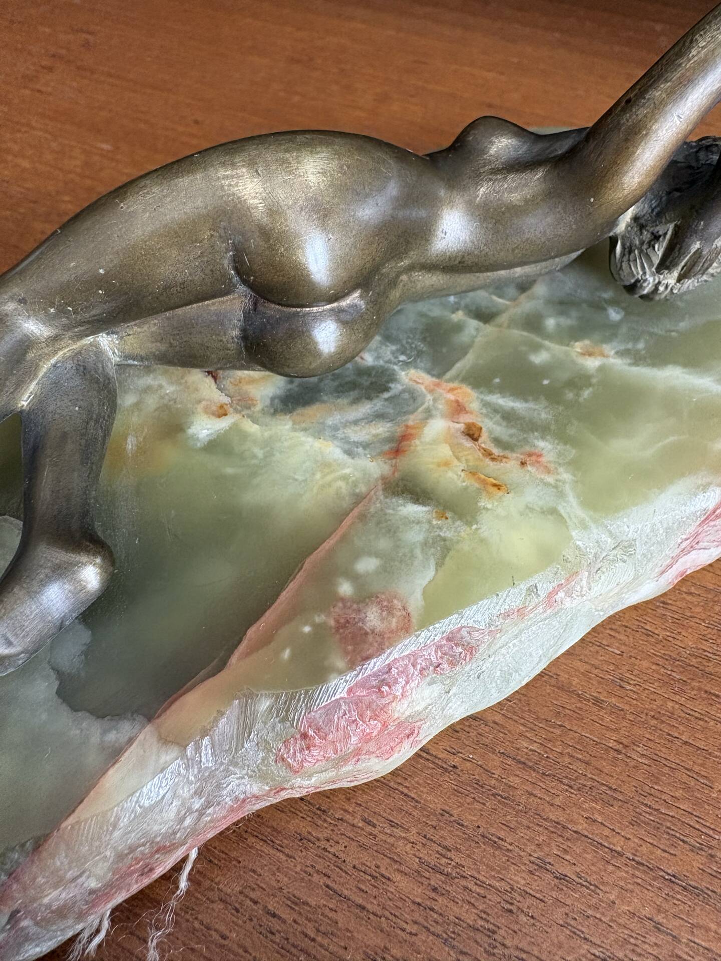 Art Deco female sculpture in bronze with onyx base.