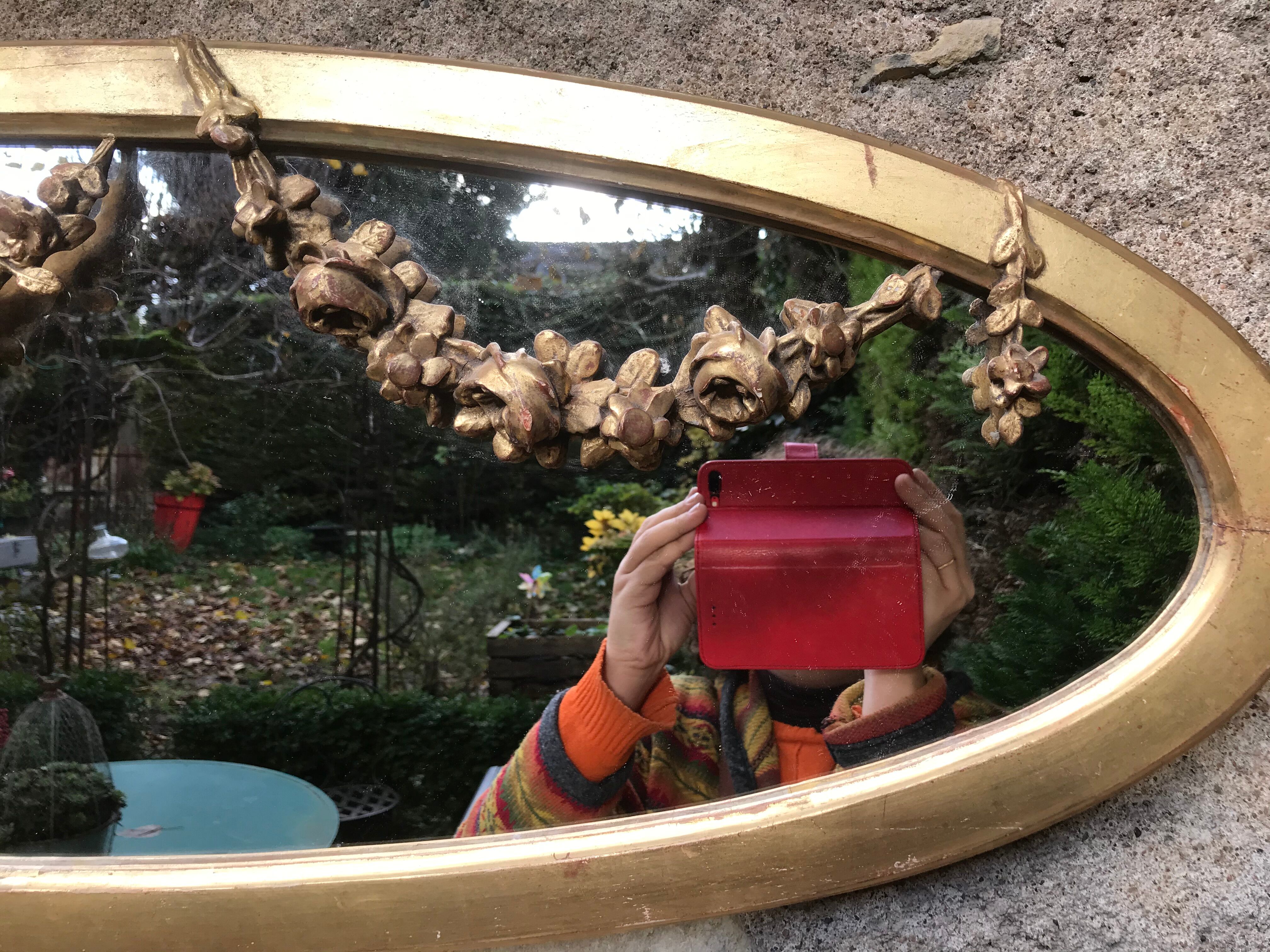 Golden oval mirror with gold leaf 106 x 38 cm