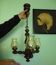 Suspension with three lights, turned varnished wood, amber tulip shade, 1970s.