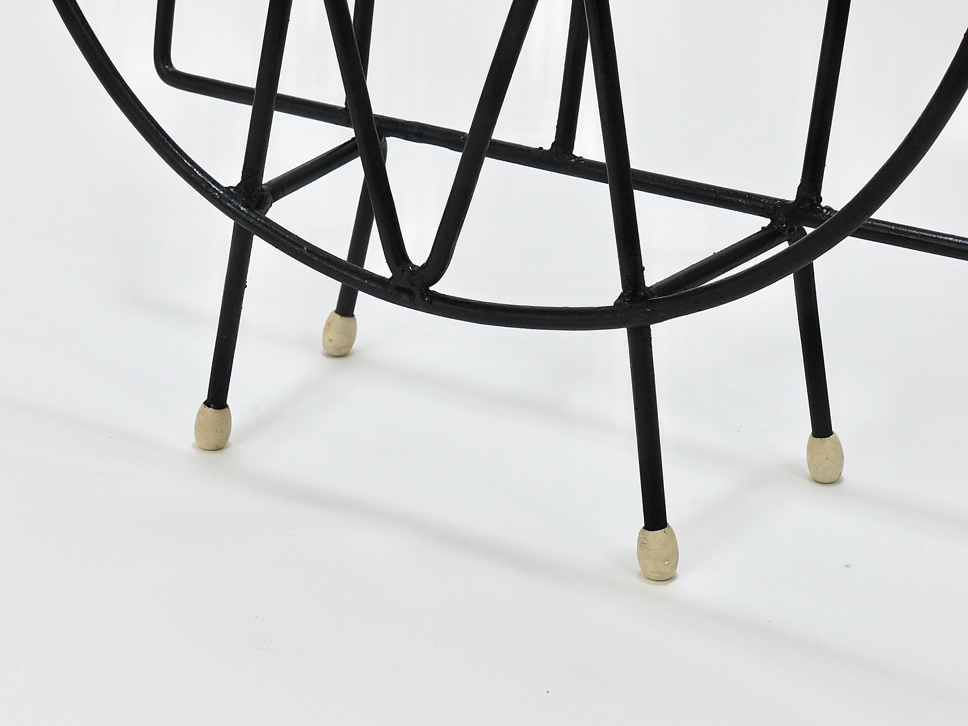 Mid-century cat-shaped magazine or record holder, iron, Italy, 1950s.