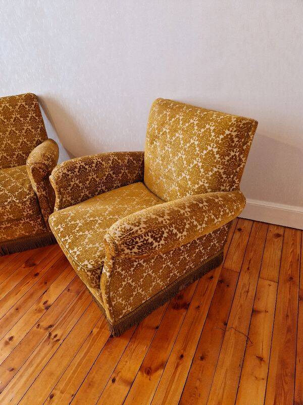 Pair of golden fringed armchairs