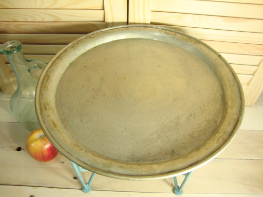 Small metal coffee table or plant stand.