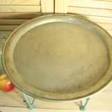 Small metal coffee table or plant stand.