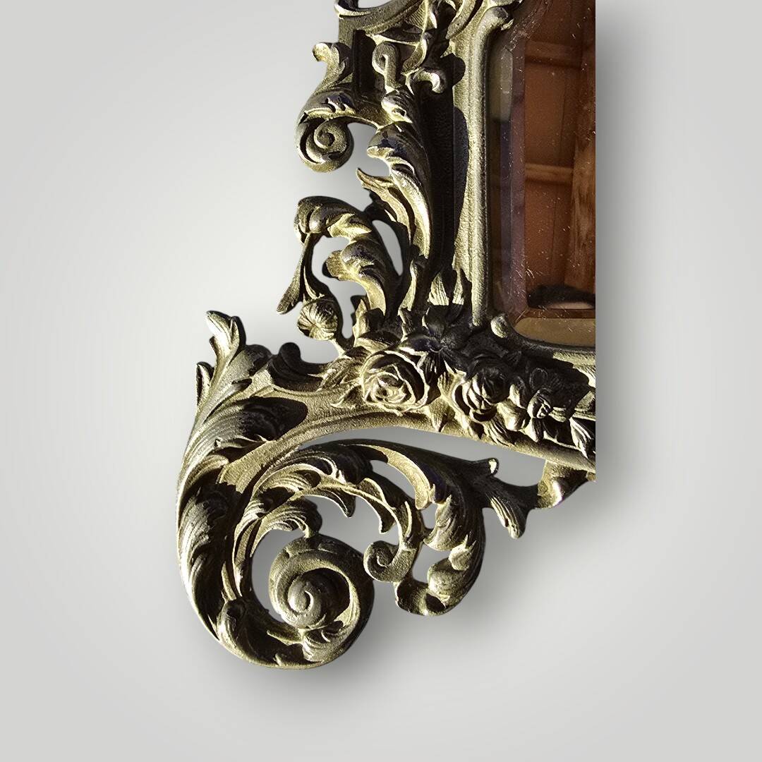 Gilded bronze wall mirror, beveled glass