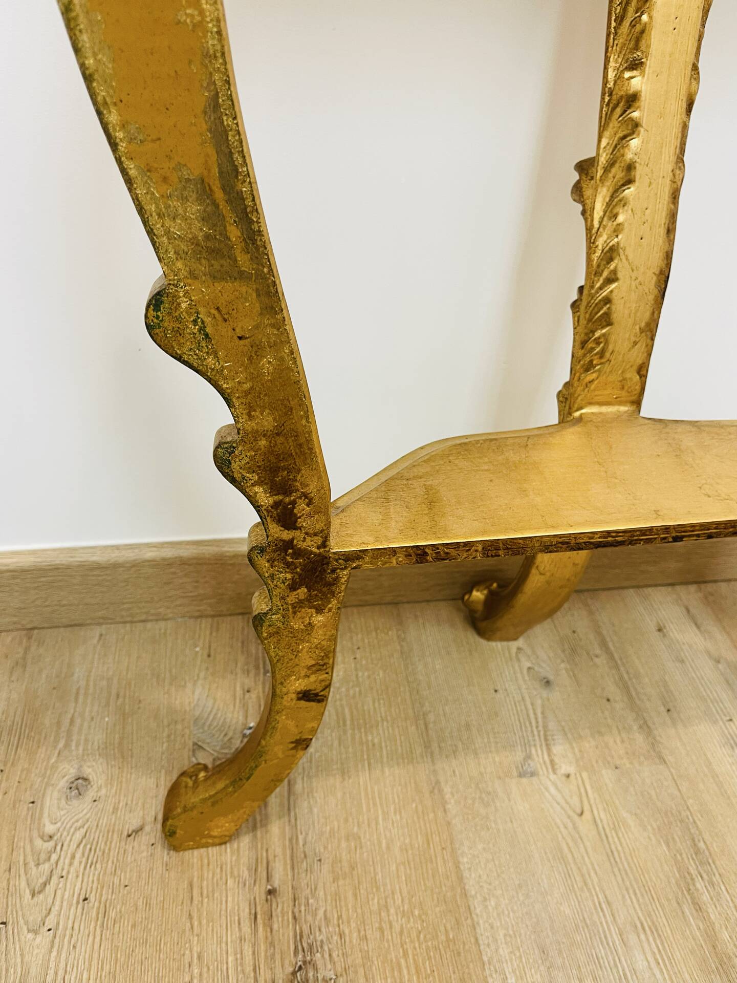 Golden console in Louis XV Rococo style made of resin.