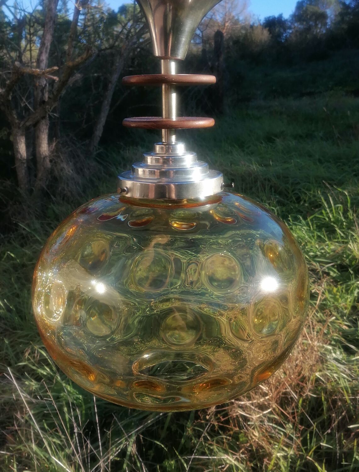 Vintage suspension ball in amber glass