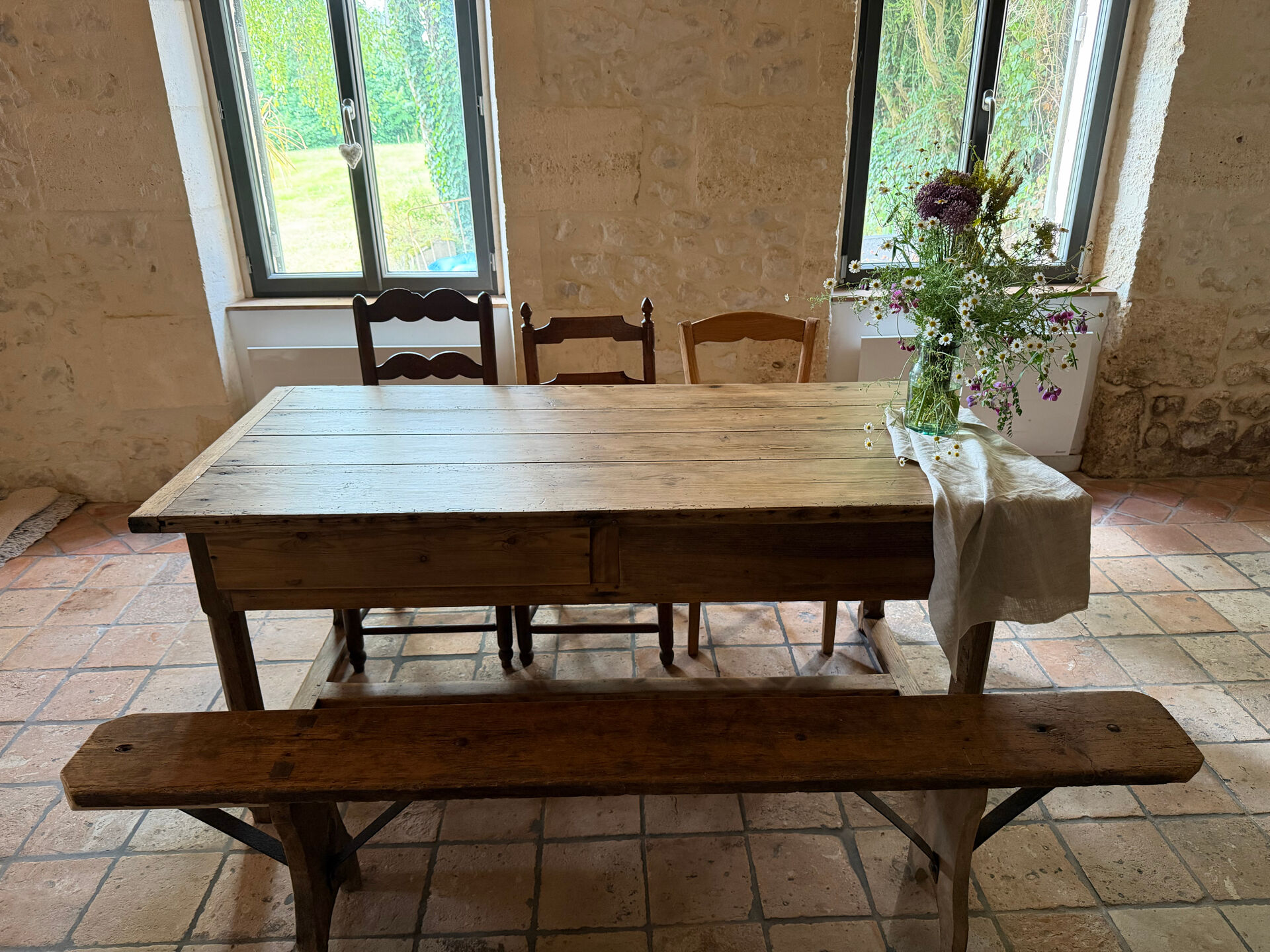 Renovated raw wood farmhouse table