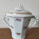 Antique porcelain sugar bowl with a decagonal base.