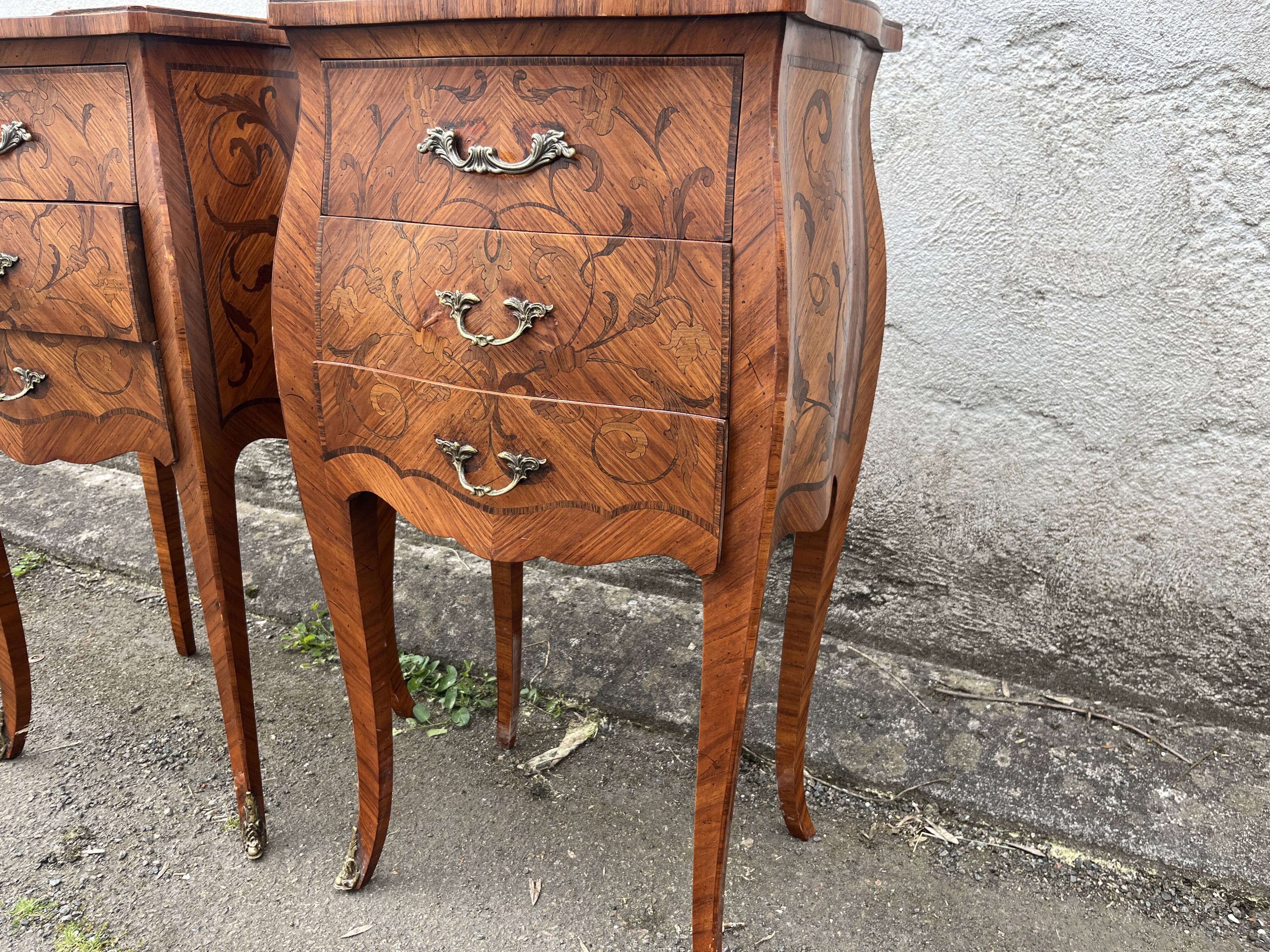 Pair of bedside tables with bombé shape, marquetry, and bronze in Louis XV style.