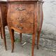 Pair of bedside tables with bombé shape, marquetry, and bronze in Louis XV style.