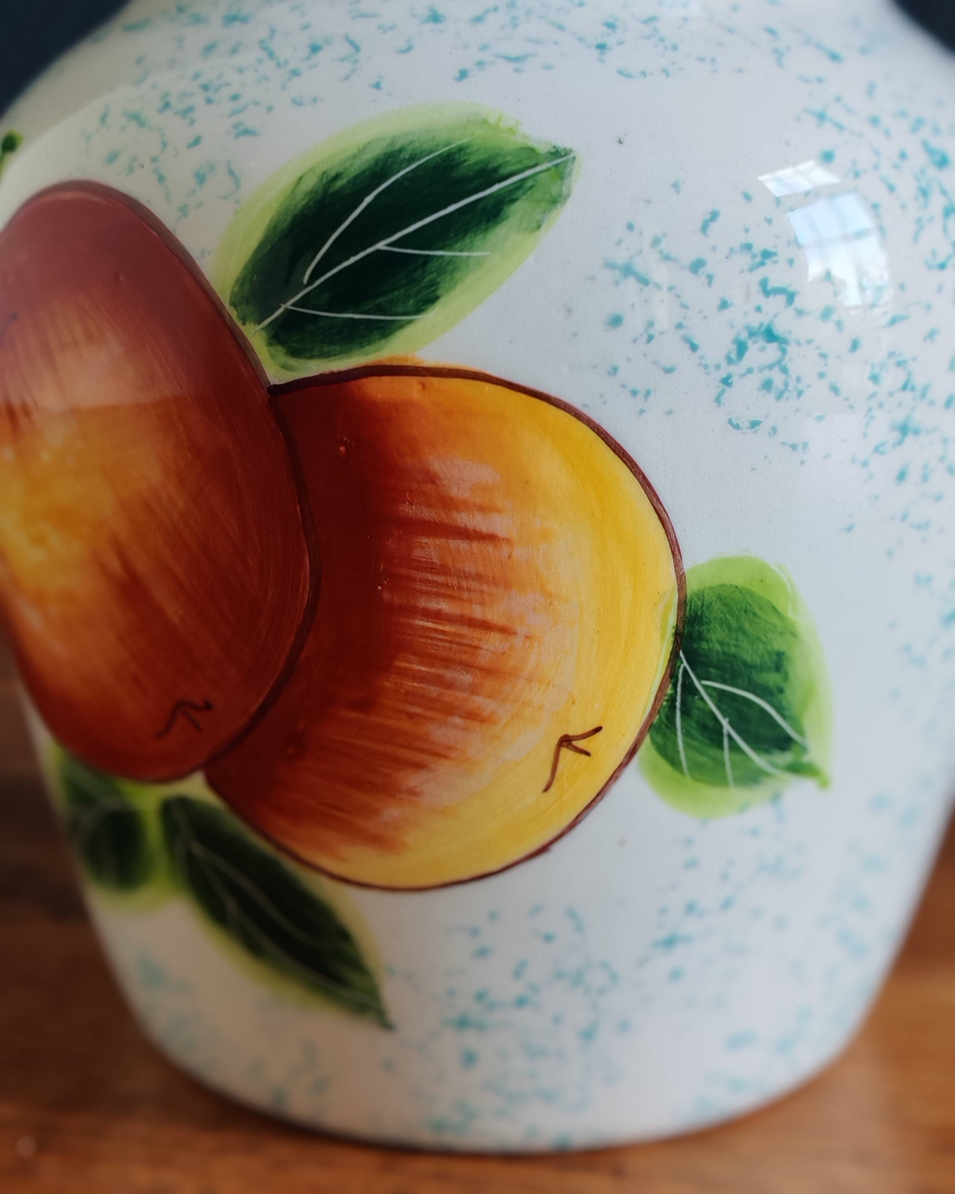 White Ceramic Vase with Peach and Leaf Motifs
