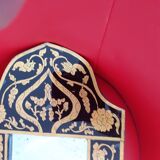 Mirror with black and gold screen-printed glass surround