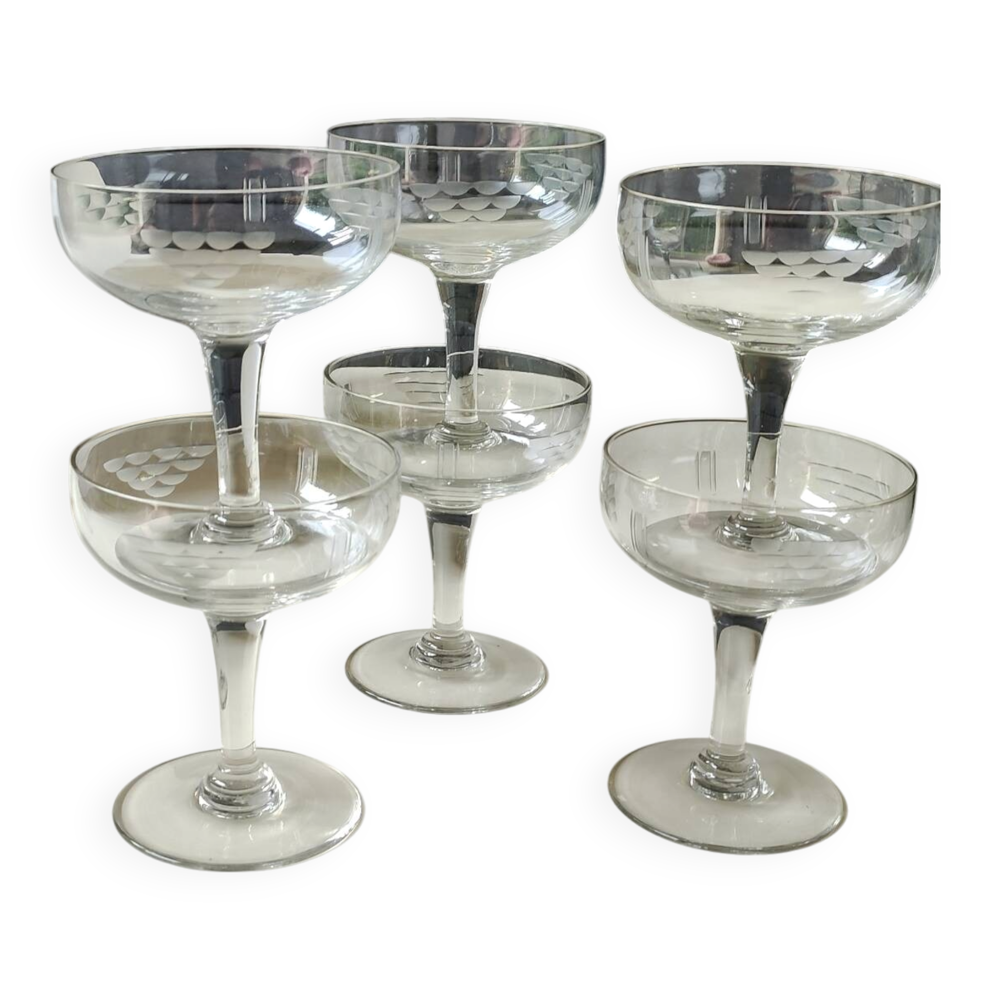 Set of 6 Baccarat-style champagne glasses. Stylized grape cluster decoration.