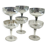 Set of 6 Baccarat-style champagne glasses. Stylized grape cluster decoration.