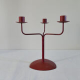 Red metal chandelier for three candles