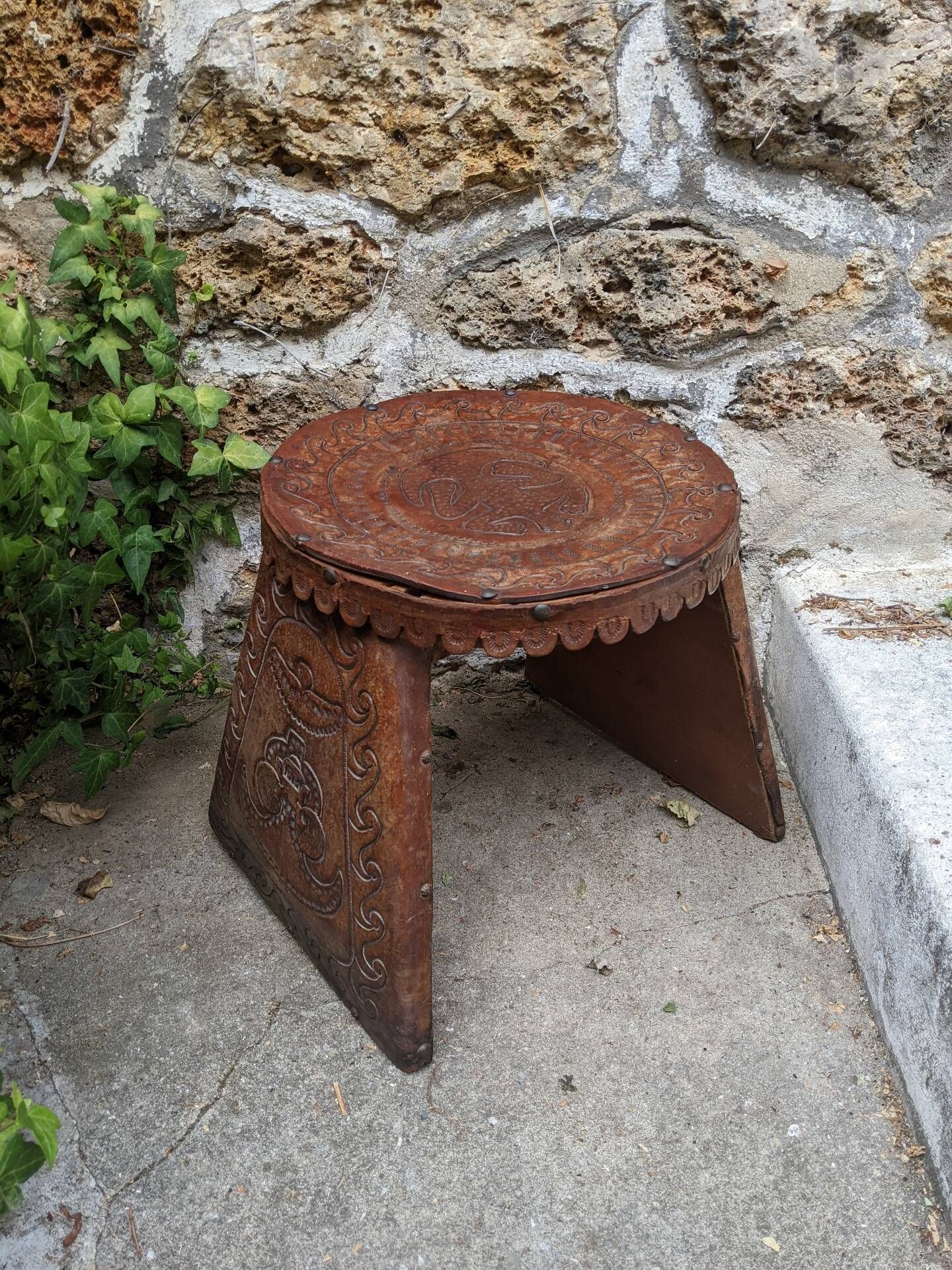 Wood and leather stool, handcrafted African art.
