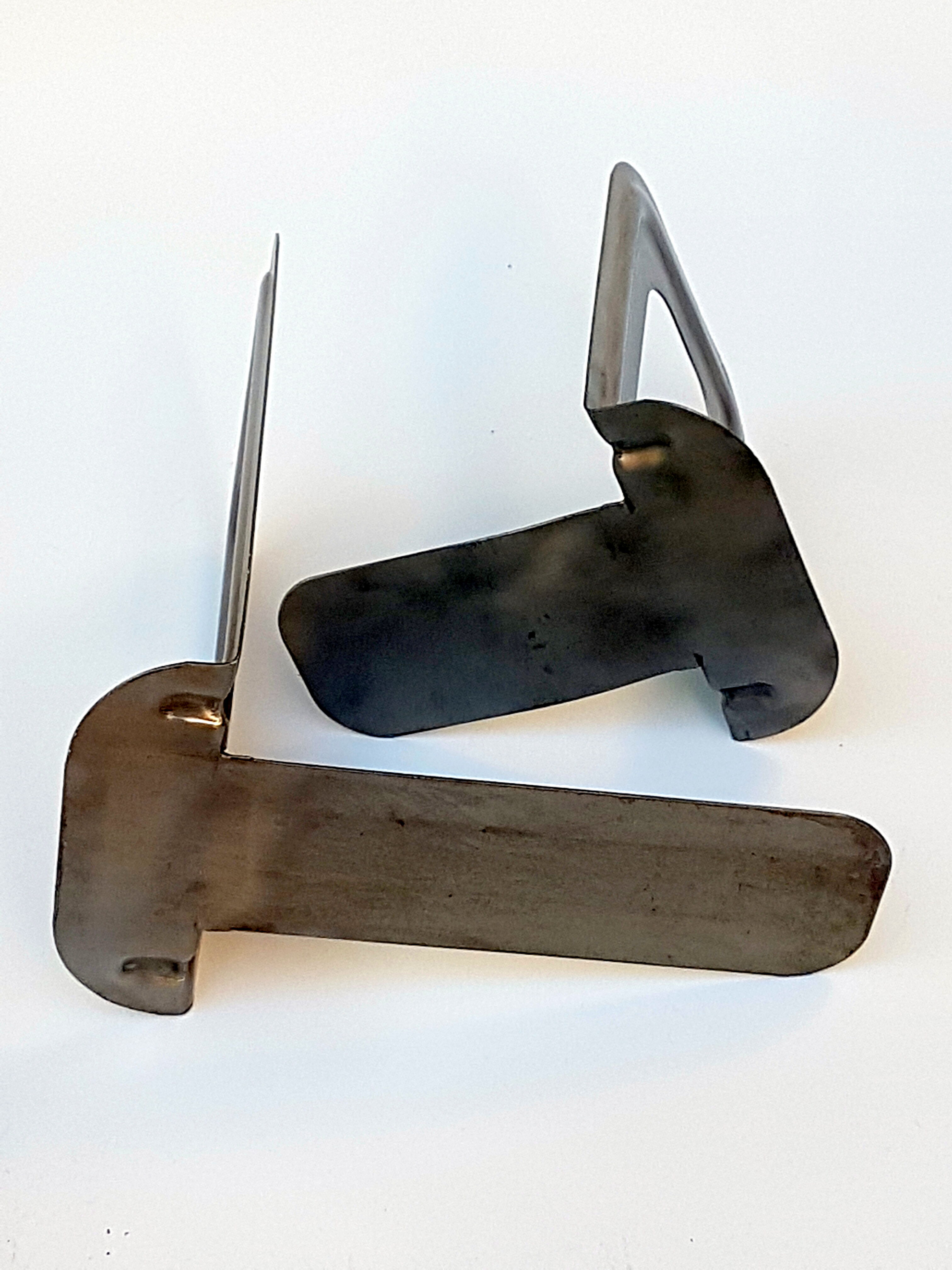 Metal book clamsended by Bernard-Albin Gras for Gras Ravel