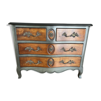 Curved patinated chest of drawers