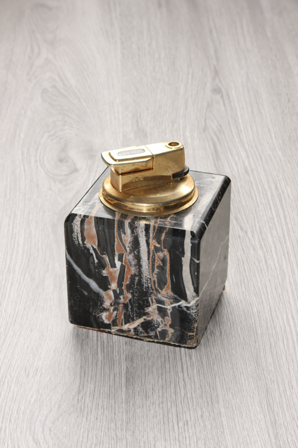 Vintage table lighter in black marble and brass