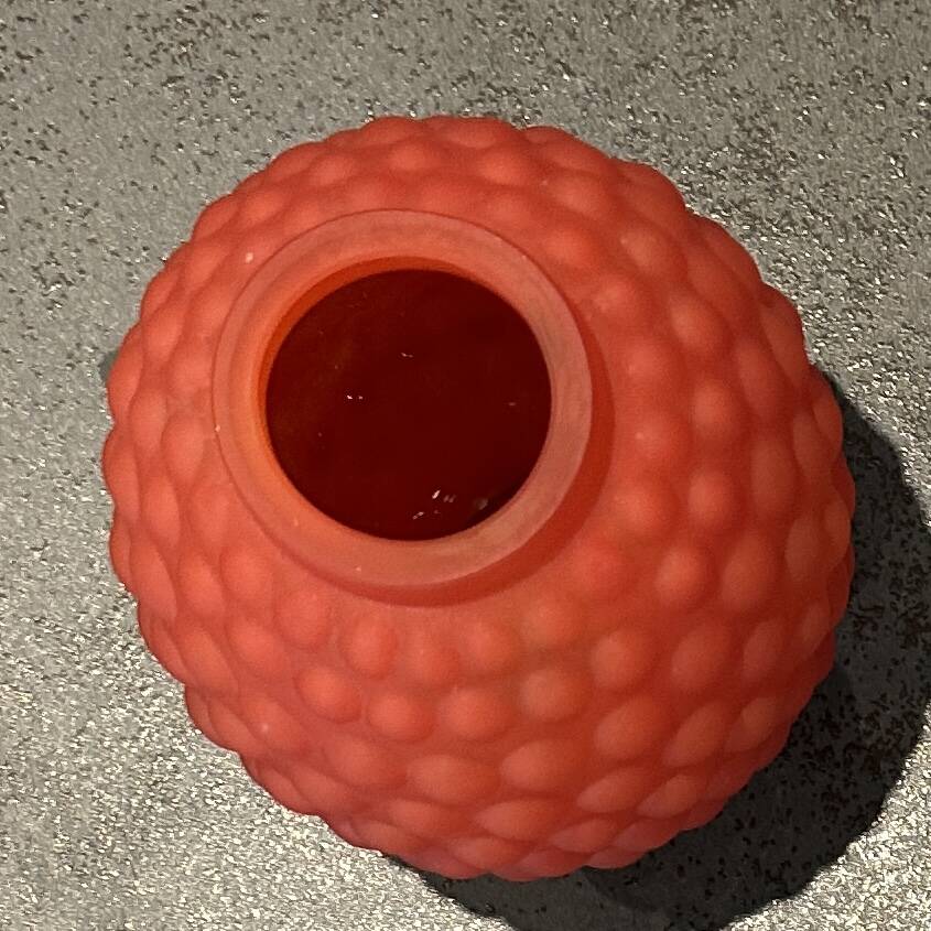 Small Art Deco ball vase in red-orange tinted glass