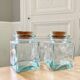 Pair of square jars in tinted glass and corks