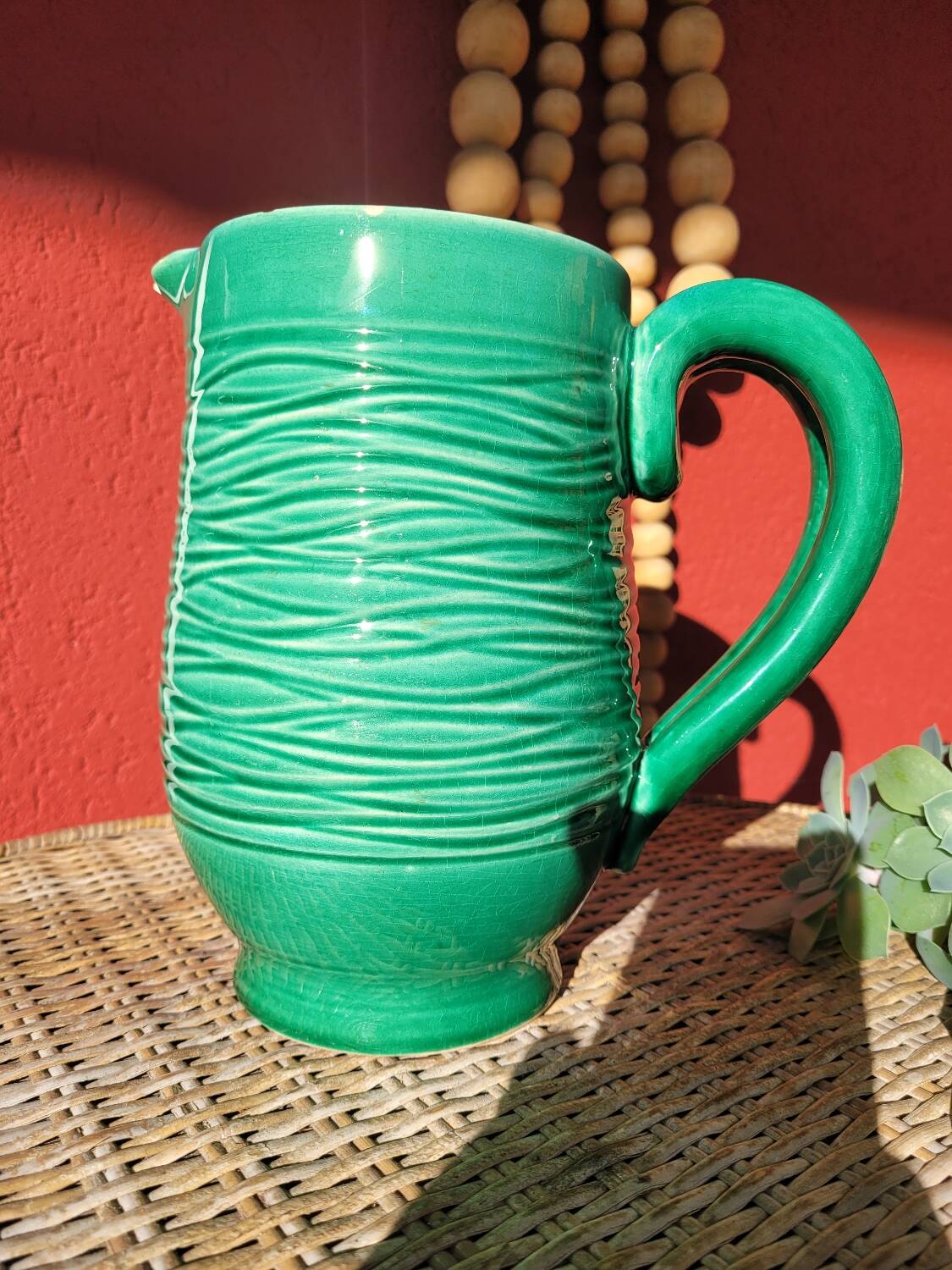 Green glazed ceramic pitcher