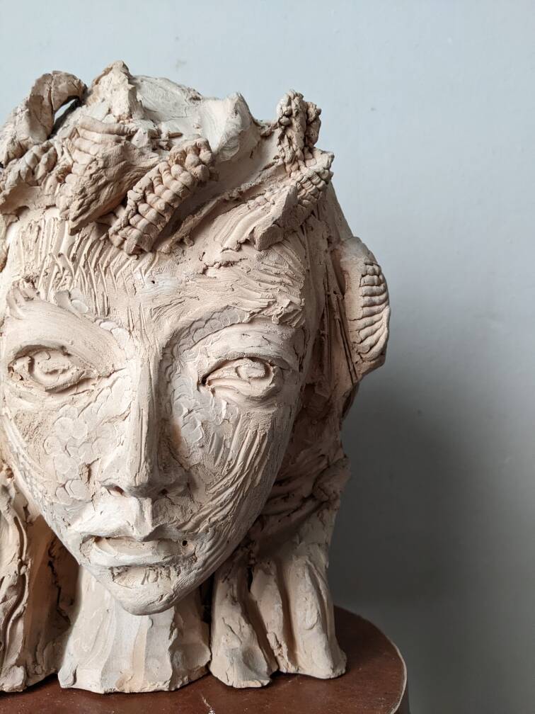 Handmade clay terracotta sculpture head decoration workshop